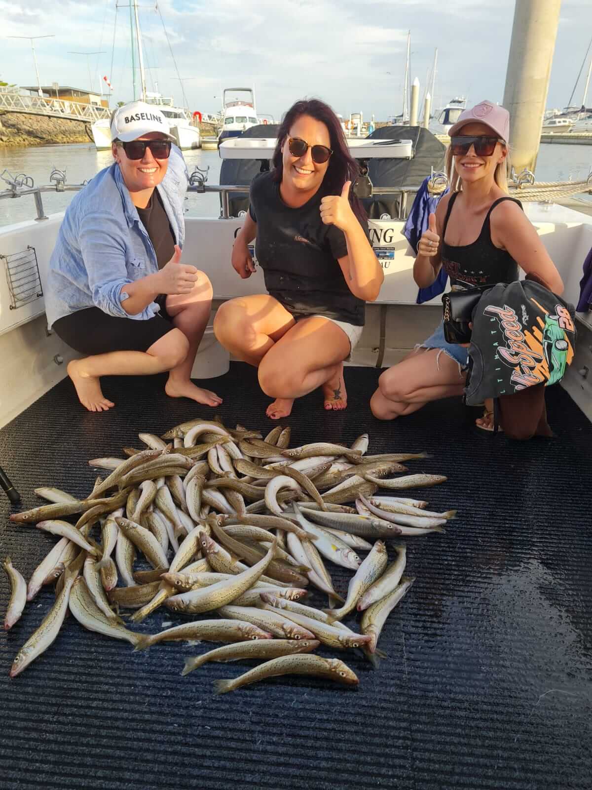 trhee girls with fishes on cardt